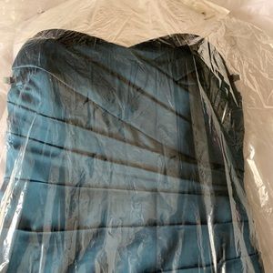 Dark teal full length strapless formal.